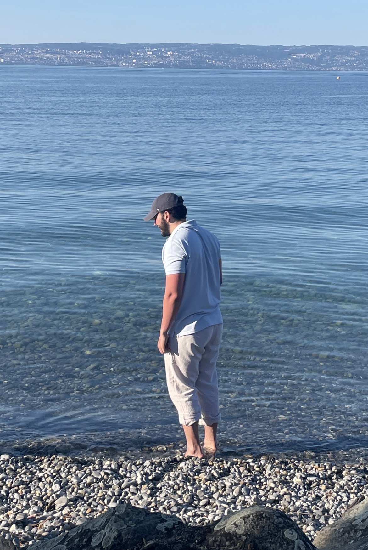 Lucas Paraizo standing by the water