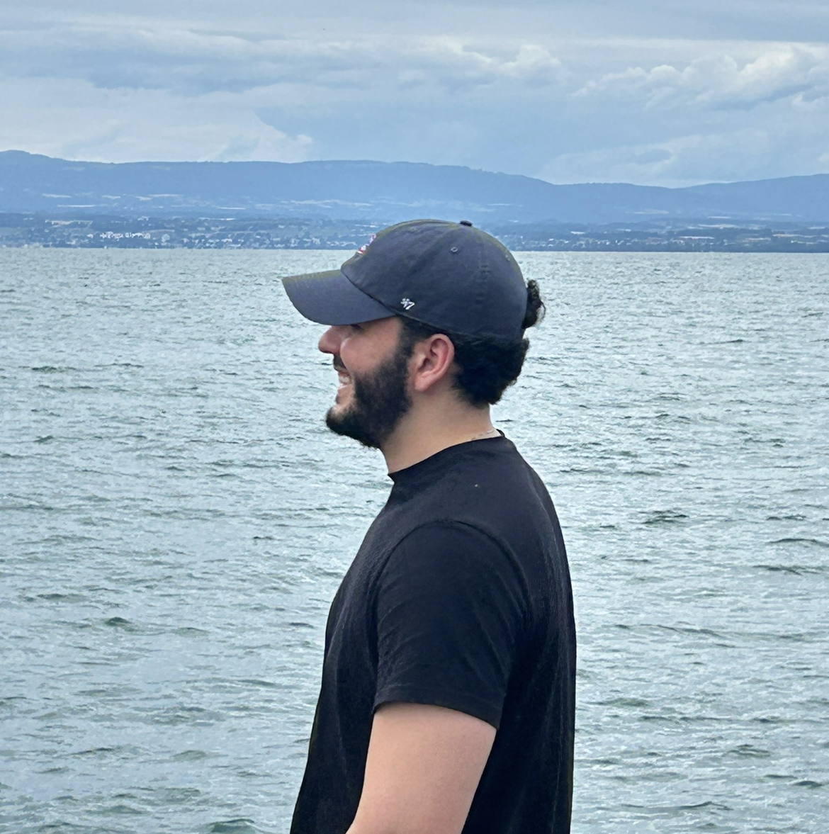 Lucas Paraizo standing by the water